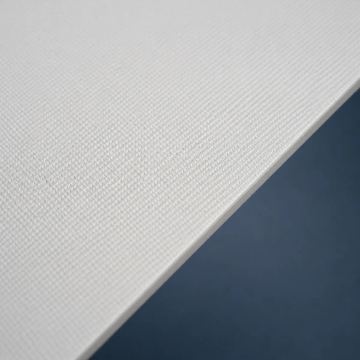 Close-up showing the surface texture of Glass Fabric Composite Acoustic Facing.